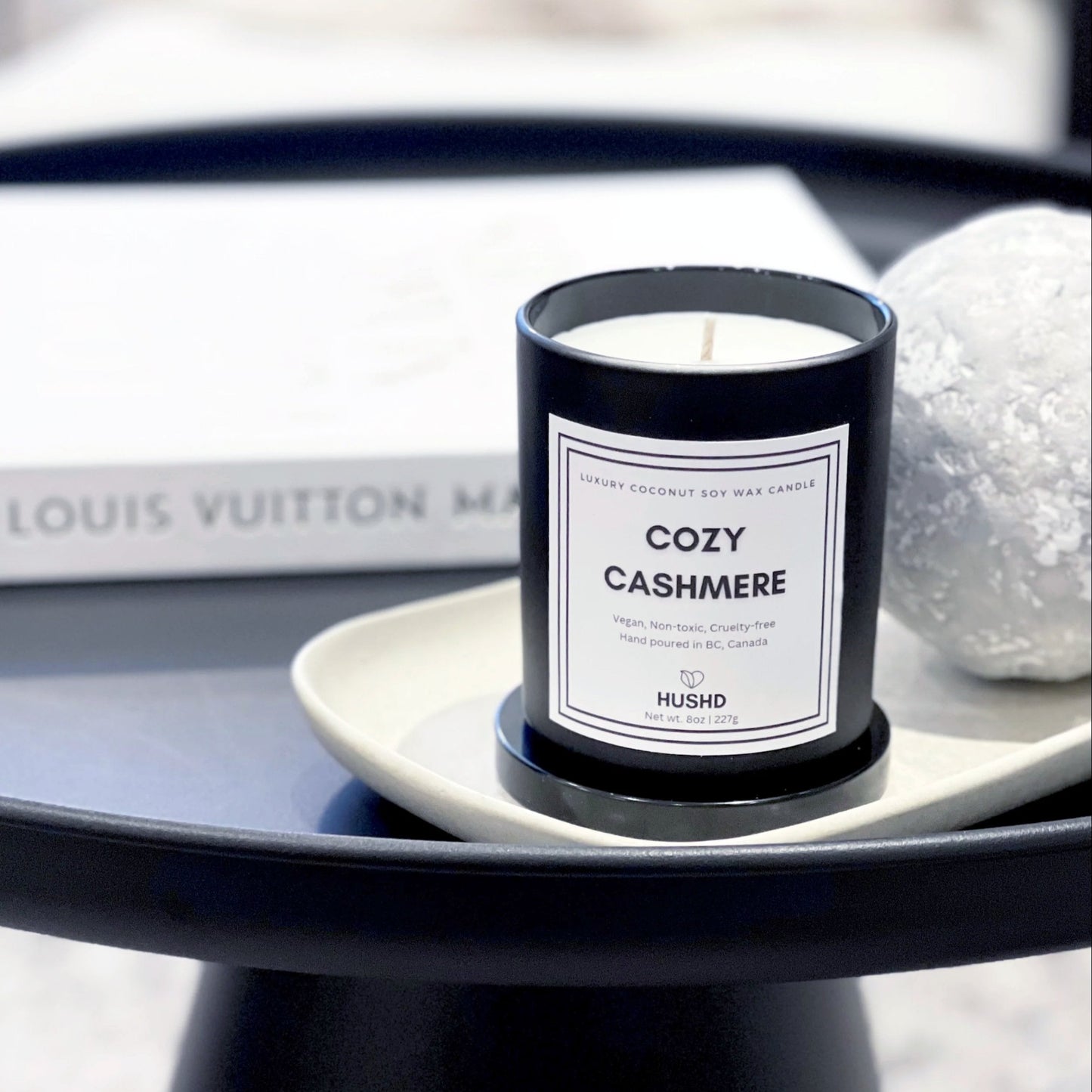 Cozy Cashmere coconut soy candle in matte black jar with almond, cardamom and sandalwood scent, hand poured in Canada.